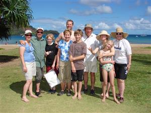 family at the beach smiling